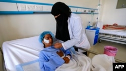 A Yemeni girl injured during a reported airstrike in the Kisar district of the northern Hajjah province receives treatment at a hospital in the Houthi rebel-held capital Sanaa, March 11, 2019.