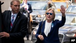 Democratic presidential candidate Hillary Clinton walks from her daughter's apartment building Sunday, Sept. 11, 2016.