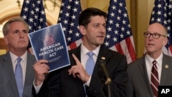 House Speaker Paul Ryan, R-Wis. (center) stands with Greg Walden, R-Ore. (right) and House Majority Whip Kevin McCarthy, R-Calif., during a news conference on the American Health Care Act on Capitol Hill.