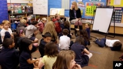 First grade teacher Lynda Jensen teaches her class of 30 children Thursday, Jan. 24, 2013, at the Willow Glenn Elementary School in San Jose, California. (AP Photo/Ben Margot)