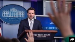 White House Press Secretary Josh Earnest speaks during the daily briefing at the White House in Washington, March 9, 2015.