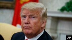 Frank Salazar, 70, shows an 'I voted' sticker after casting his ballot on the Super Tuesday, at a voting center in Alhambra, Calif., March 3, 2020. 