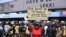 A demonstrator holds a placard to protest against abuses by the Special Anti-Robbery Squad (SARS) at the Lekki toll plaza in Lagos, Nigeria, Oct. 12, 2020.