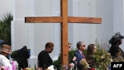 Mourners wait in line to attend the funeral of Cynthia Hurd, 54, at the Emanuel African Methodist Episcopal Church in Charleston, S.C., where she was killed June 17 along with eight others, June 27, 2015.