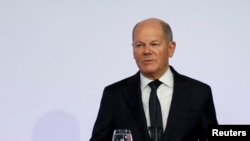 Umushikiranganji wa mbere w'Ubudagi acuye igihe, Olaf Scholz.