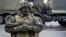 FILE - A pro-Russia rebel stands guard in Donetsk, eastern Ukraine, Oct. 29, 2015.