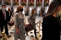 Electoral College ballot boxes are carried to the House of Representatives at the U.S. Capitol in Washington, D.C., Jan. 6, 2021.
