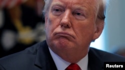 President Donald Trump attends a Cabinet meeting on Day 12 of the partial U.S. government shutdown at the White House in Washington, Jan. 2, 2019.
