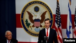 FILE - U.S. Ambassador to Israel David Friedman sits next to White House Senior Adviser Jared Kushner as he speaks during the dedication ceremony of the new U.S. embassy in Jerusalem, May 14, 2018.