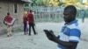 A Pokomo villager uses Una Hakika to check the truth of rumors he hears, most of which are false, Tana Delta, Kenya, Nov. 24, 2014. (Hilary Heuler / VOA News)