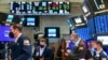 FILE - Traders work on the floor of the New York Stock Exchange, May 18, 2021. Investors remain focused on the possibility for more inflation later this year. (NYSE photo)