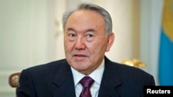FILE - Kazakhstan's President Nursultan Nazarbayev attends a meeting at his office in Almaty, Feb. 25, 2013.