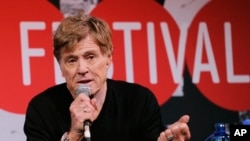 FILE - Robert Redford addresses reporters in Park City, Utah, Jan. 16, 2014. 