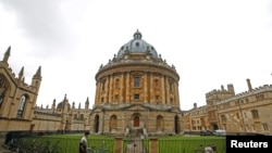 FILE - A man walks in front of the buildings of Oxford University, amid the spread of the coronavirus disease (COVID-19) in Oxford, Britain, Oct. 6, 2020.