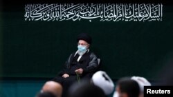 علی خامنه‌ای.