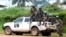 FILE - Blue-helmeted members of the U.N. Organization Stabilization Mission in the Democratic Republic of Congo sit on the back of a pickup truck in Beni, Oct. 23, 2014.