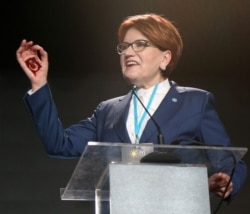 FILE - Leader of the Good Party Meral Aksener gestures as she speaks during the party's 4th Extraordinary Meeting in Ankara, Turkey, on Aug. 3, 2019.