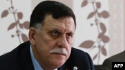 Libya's Prime Minister-designate Fayez al-Sarraj chairs a Presidential Council of the Government of National Reconciliation meeting with local mayors inside the naval base in the Libyan capital, Tripoli, April 3, 2016. 