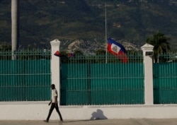 The Haitian flag flies at half-staff at the Presidential Palace in Port-au-Prince, Haiti, July 10, 2021, three days after President Jovenel Moise was assassinated in his home.