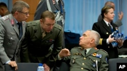 European defense officials confer at the EU Council building in Brussels, Belgium, Nov. 7, 2016. A plan to set up a joint defense fund would allow EU countries to move away from the current system, in which many pursue their own defense projects, favoring local manufacturers and duplicating efforts. 