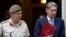 Britain's Defense Secretary Philip Hammond, right, and the Chief of Defense Staff Gen. Nick Houghton leave 10 Downing street following a national security meeting at Dow ning Street in London, Aug. 28, 2013.