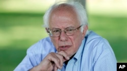 FILE - Democratic presidential candidate, Sen. Bernie Sanders, I-Vt., speaks during a television interview before a town hall meeting, Sept. 3, 2015, in Grinnell, Iowa.