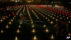 Georgians light candles for victims of the war with Russia as they mark the third anniversary of the conflict in Gori, Aug. 8, 2011. 