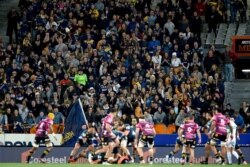 Spectators watch the Super Rugby Aotearoa rugby game between the Highlanders and Chiefs in Dunedin, New Zealand, June 13, 2020.