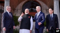 President Joe Biden greets from left, Australia's Prime Minister Anthony Albanese, India's Prime Minister Narendra Modi and Japan's Prime Minister Fumio Kishida, at the Quad leaders summit at Archmere Academy in Claymont, Delaware, Sept. 21, 2024.