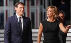 Leader of Ciudadanos' party Albert Rivera and debate moderator Maria Casado arrive at a televised debate ahead of general elections in Madrid, Spain, Nov. 4, 2019.