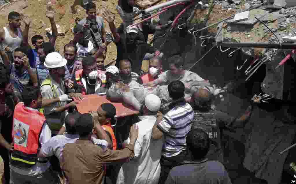 President Barack Obama, right, and French President Francois Hollande place flowers at the Bataclan, site of one of the Paris terrorists attacks, to pay respects after arriving in town for the COP21 climate change conference in Paris.