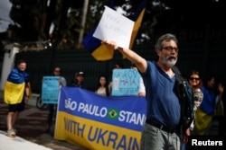 People take part in a protest against Russia's Foreign Minister Sergei Lavrov visit to Brazil and to support Ukraine in Sao Paulo, Brazil, April 17, 2023.