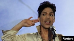 FILE - Prince performs at the 2011 Hop Farm Festival in southern England July 3, 2011. An investigation continues into the U.S. musician's death April 21, 2016. 