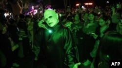 This photo taken on Oct. 30, 2023 shows a person in costumes posing on a street ahead of Halloween in Shanghai.