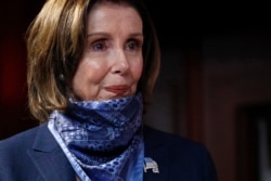 House Speaker Nancy Pelosi of Calif., waits to speak with reporters after the Senate approved a nearly $500 billion coronavirus aid bill, April 21, 2020, on Capitol Hill in Washington.