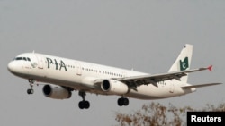 FILE - A Pakistan International Airlines (PIA) plane prepares to land at Islamabad airport in Islamabad, February 24, 2007.