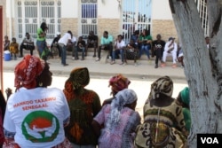 FILE - Khalifa Sall supporters sit in front of the Supreme Court, waiting for the verdict on the mayor’s request for temporary release during the election campaign, in Dakar, Senegal, July 20, 2017. (S. Christensen/VOA)