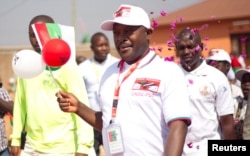 FILE - Burundi's President Pierre Nkurunziza arrives for the ruling Conseil National pour la Defense de la Democratie - Forces pour Defense de la Democratie (CNDD-FDD) party extraordinary congress in Gitega Province, Burundi, Aug. 20, 2016.