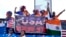 Fans of the United States cricket team cheer before an ICC Men's T20 World Cup cricket match between the United States and Ireland at the Central Broward Regional Park Stadium in Lauderhill, Fla., June 14, 2024. The match was abandoned due to rain. 