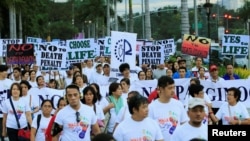 Participants join a procession against plans to reimpose death penalty, promote contraceptives and intensify drug war during "Walk for Life" in Manila, Philippines, Feb. 18, 2017.
