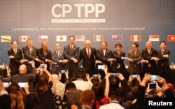 Đại diện 11 thành viên CPTPP tại một buổi lễ hồi tháng 3/2018