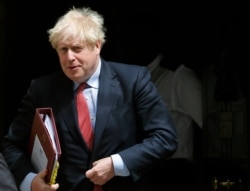 Britain's Prime Boris Johnson leaves 10 Downing Street to attend the weekly Prime Minister's Questions session, in parliament in London, July 15, 2020.