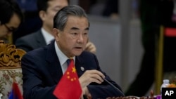 FILE - Chinese Foreign Minister Wang Yi speaks during the Special ASEAN-China Foreign Ministers' meeting on the Novel Coronavirus Pneumonia in Vientiane, Laos, Feb. 20, 2020.