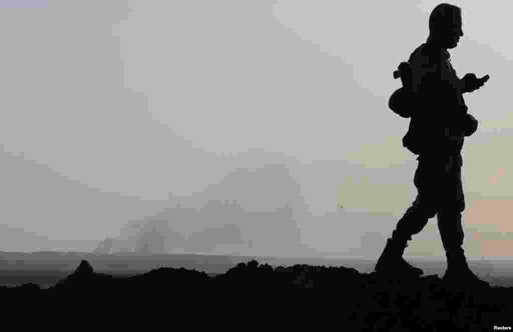 Smoke rises from a recent U.S. air strike on Islamic State militant positions in Khazir, on the edge of Mosul, Sept. 16, 2014. 