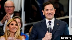 Newly confirmed U.S. Secretary of State Marco Rubio speaks next to his wife Jeanette Dousdebes Rubio at the State Department in Washington, Jan. 21, 2025. Rubio is scheduled to visit Panama and other countries in Central America.