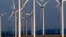 FILE - A wind turbine farm owned by PacifiCorp near Glenrock, Wyoming, cranks out electricity, May 6, 2013.