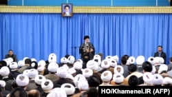 A handout picture released by the official website of the Center for Preserving and Publishing the Works of Iran's Supreme Leader Ayatollah Ali Khamenei, shows him delivering a speech in Tehran, Sept. 27, 2015. 