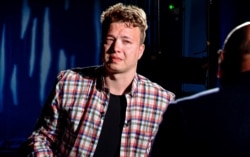 FILE - In this screen grab from video released by Belarusian state-controlled ONT Channel June 3, 2021, dissident journalist Raman Pratasevich reacts while being interviewed, in Minsk, Belarus.