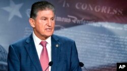 Sen. Joe Manchin, D-W.Va., speaks with reporters during a news conference on Capitol Hill, Nov. 1, 2021.