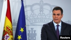 Spain's Prime Minister Pedro Sanchez delivers a statement on the political crisis in Venezuela at the Moncloa Palace in Madrid, Spain, Feb. 4, 2019. 